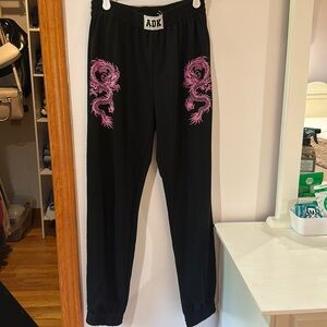 adika black sweats with pink dragons